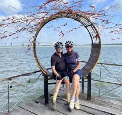 Trish and Larry Goodman Cycling on the  tour with redspokes